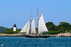 Schooner Passes by Ten Pound Island Lighthouse in Massachusetts